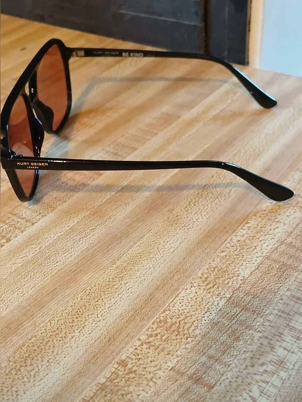 Kurt Geiger Black Frame Sunglasses with Pink Lenses